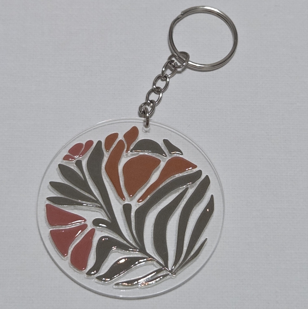Floral Acrylic Keychain with Brown and Green Accents